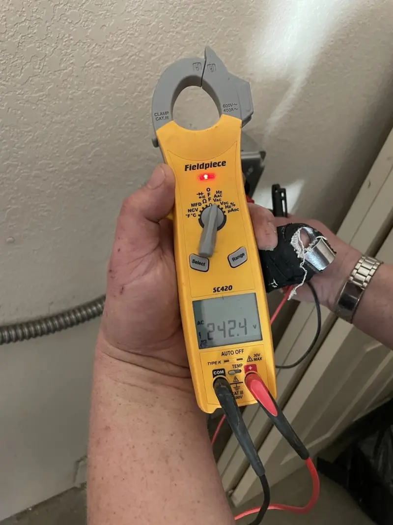 Voltage testing with clamp meter during Electrical Installation Services in East Wenatchee